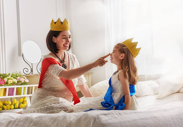 istock queen and princess in gold crowns 600390804