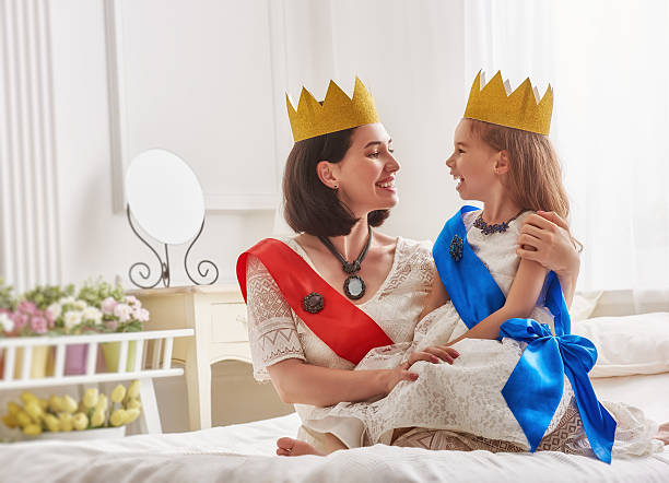 istock queen and princess in gold crowns 600390876