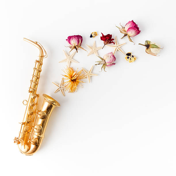 istock Jazz Day. Saxophone with flowers. Flat lay, top view 600391256