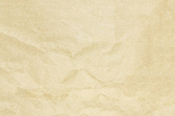istock Recycled crumpled brown paper texture or paper background. 600392878