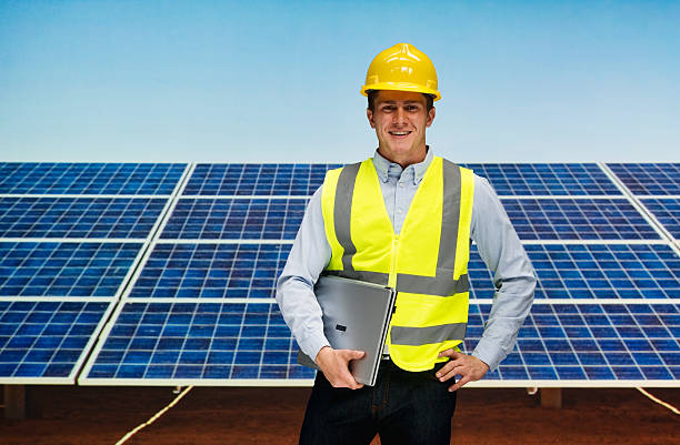 istock Smiling solar worker standing outdoors 600392898