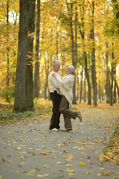 istock Senior couple in autumn park 600393100