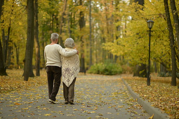 istock Senior couple in autumn park 600393242