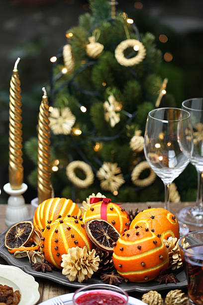istock orange pomander balls, christmas table decoration 600393546