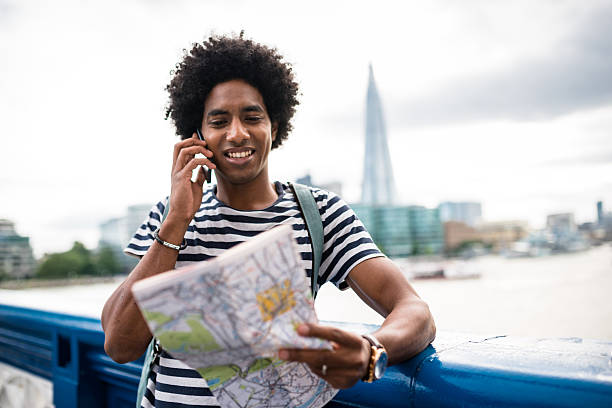 istock solo traveler in tower bridge area reading a map 600395584