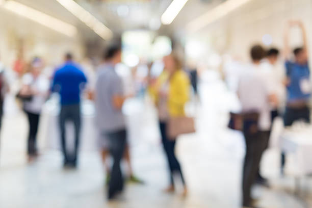 istock Abstract blurred people socializing during coffee break at business conference. 600396092