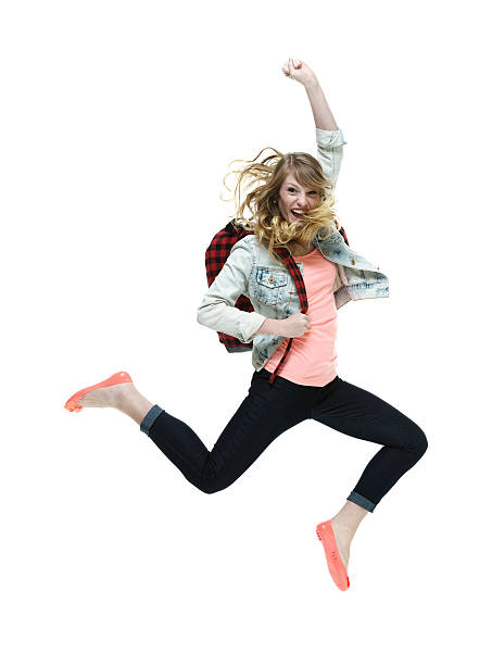 istock Smiling female student jumping and cheering 600397702