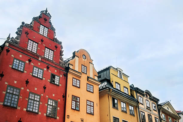 colorful buildings in old town stockholm colorful buildings in old town stockholm stortorget stock pictures, royalty-free photos & images