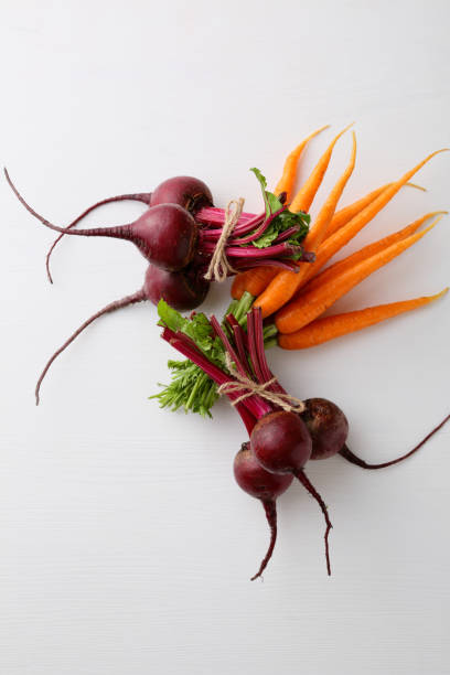 Fresh vegetables - carrots and beets, food background