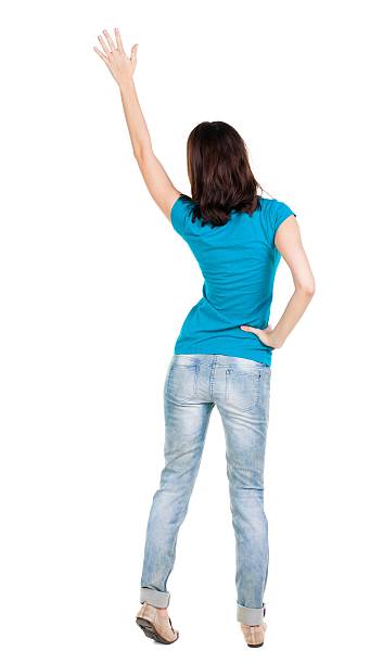 istock Back view of beautiful woman welcomes. 600402972