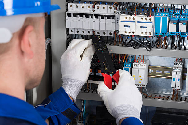 Male Electrician Repairing Fusebox Close-up Photo Of Male Electrician Repairing Fusebox wire cutter stock pictures, royalty-free photos & images