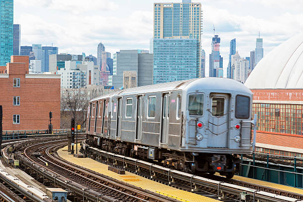istock Subway Train Speeding on Elevated Track in Queens, New York 600406274