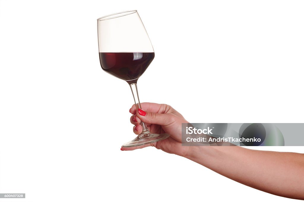 female hand with red wine glass female hand with red wine glass on a white background Wineglass Stock Photo