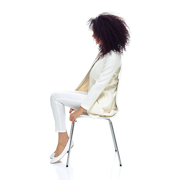 istock Smiling woman sitting on chair 600410848