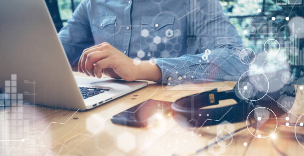 istock Businessmen Working Modern Desktop Laptop Wood Table.Global Connection Virtual 600411418