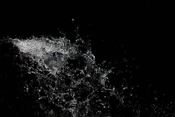 beautiful background with splashes of water on a black background stock photo