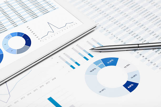 istock Business chart on the printed media and digital tablet 600411974