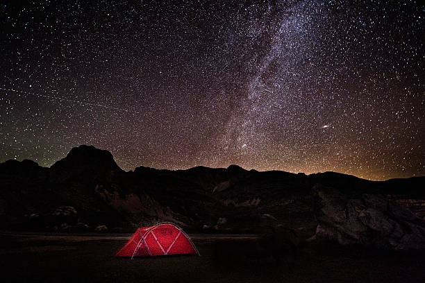istock Tent in the mountains at night 600414408