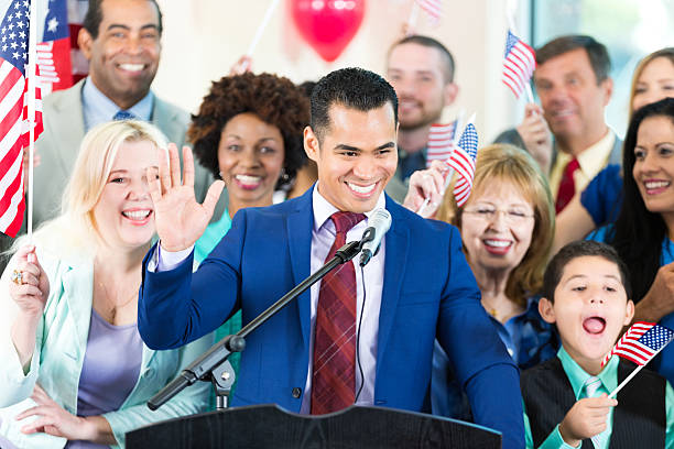 istock Hispanic man speaking during political rally to support candidate 600414870