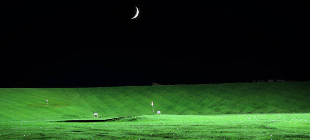 Driving Range, Flag and Moon at Night stock photo