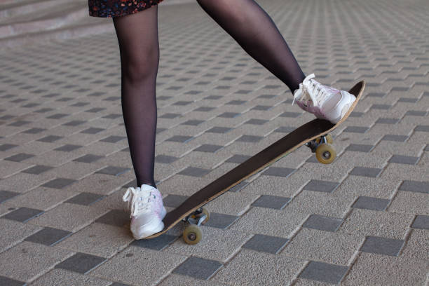 istock Girl's legs on the skateboard 600416002