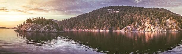 A panoramic of the sights you see in the puget sound of Washington State USA. One of the San Juan Islands which are known for their beauty and whale watching.
