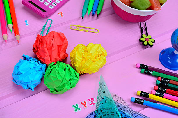 istock crumpled sheet with supplies for school on table 600417922