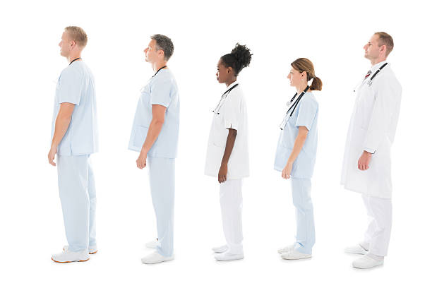 istock Side View Of Medical Team Standing In Row 600418538