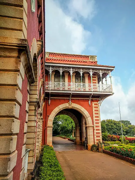 Historic Karnatak Arts College Dharwad in Karnataka India with beautiful blue sky background. This building was built in 1920 under British rule in India and classes are held even today mainly teaching undergraduate programs