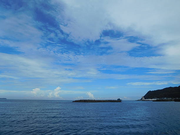 istock The calm sea shore under the summer sky 600418902