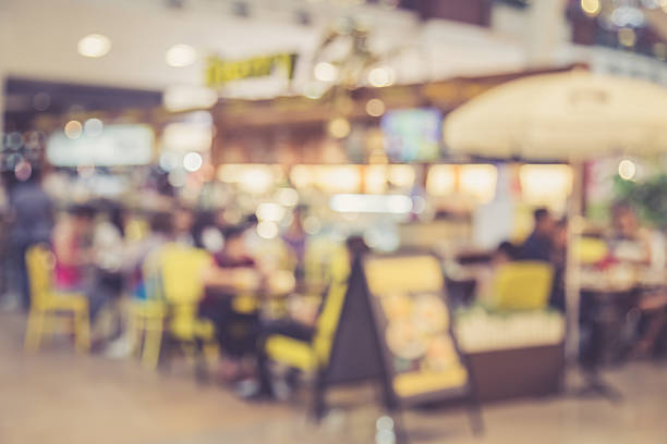 istock Blurred image of people in coffee shop with bokeh 600668262