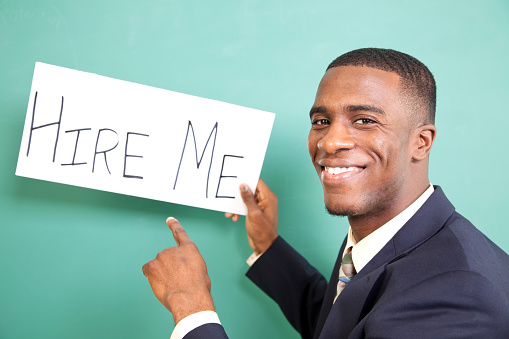 Young adult, African descent man holds 