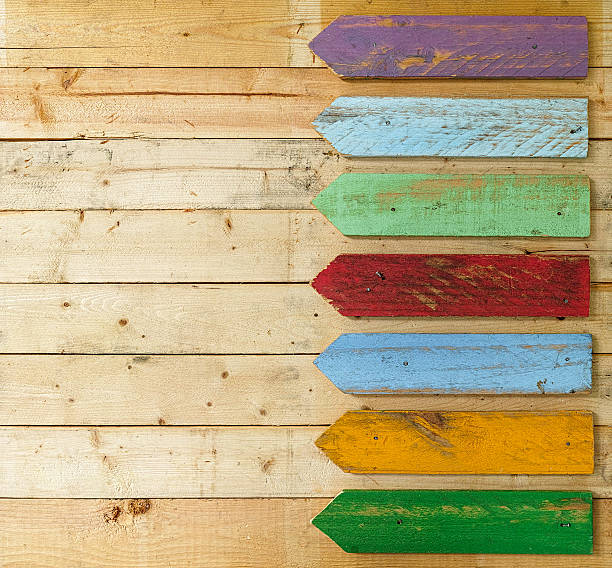 istock Old colourful weathered wood arrow signs. 600669694