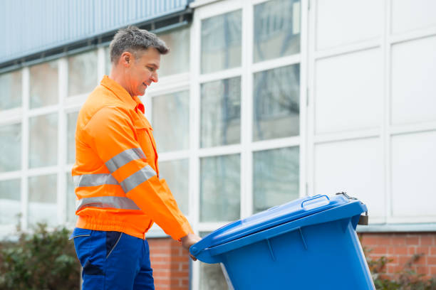 istock Male Worker Walking With Dustbin On Street 600669890