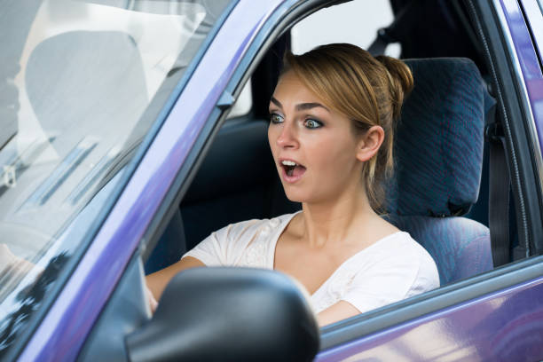 istock Shocked Woman Driving Car 600670836