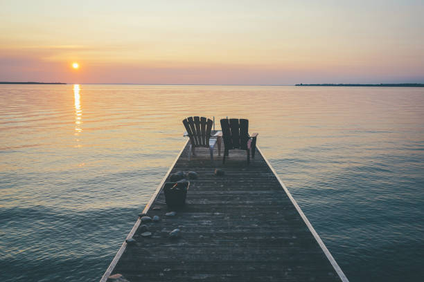 istock Sunset view of the lake from Canada cottage 600671382