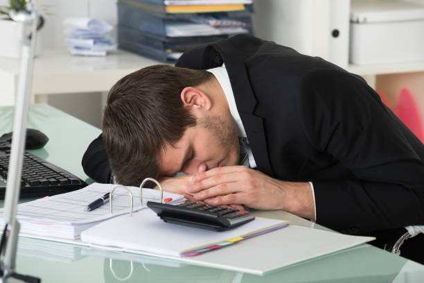 istock Businessman Sleeping With Invoice On Desk 600673910