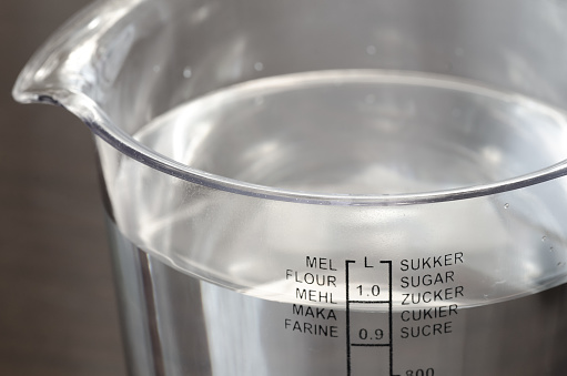 plastic kitchen measuring cup with water