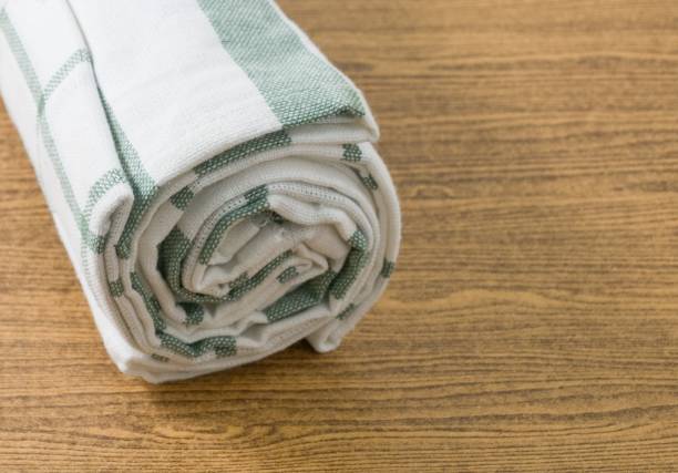istock White and Green Kitchen Towel on Wooden Table 600680758