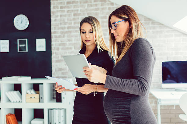 istock Two Young Businesswoman Using Digital Tablet In Their Office. 600681216