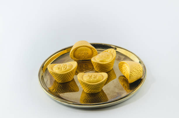 istock Gold ingot on golden plates white background 600684176
