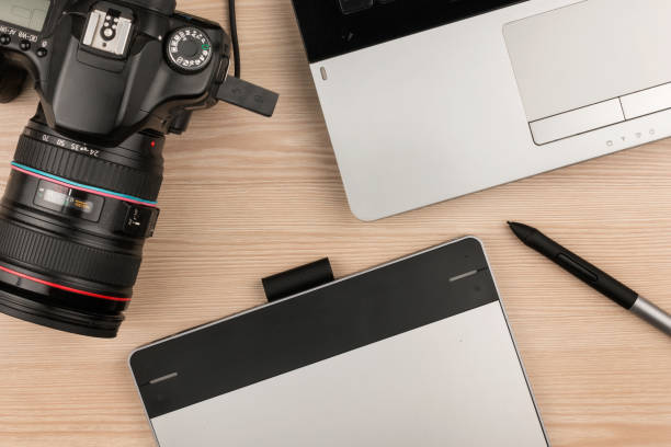 istock Working table of photographer or artist overhead view 600684210