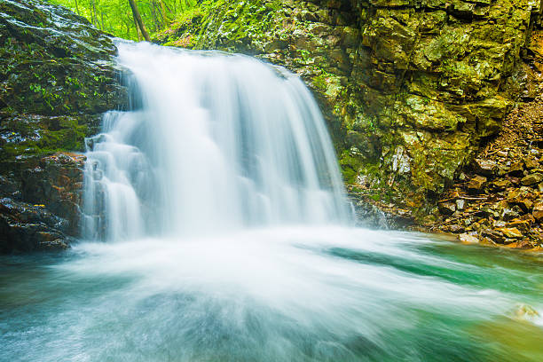 istock Deep in the mountains of the waterfall. 600687374