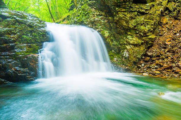 istock Deep in the mountains of the waterfall. 600687414