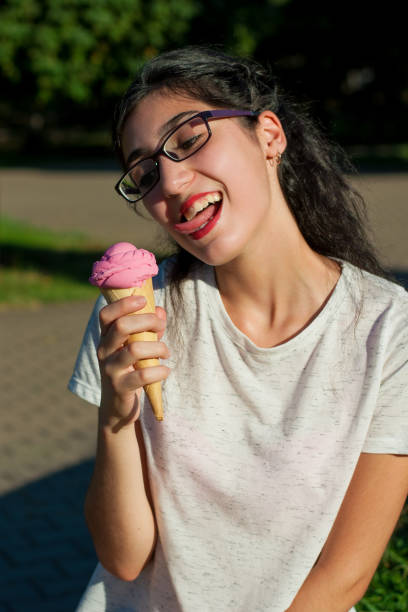 istock Girl with ice cream on the nature 600689978