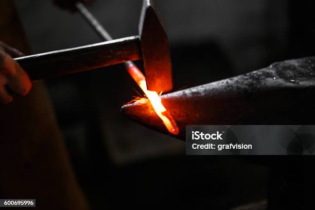 Ironsmith Hitting Hotsteel Stock Photo - Download Image Now - Anvil, Hitting, Men