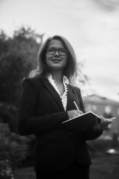 istock Young woman with a business papers 600697076