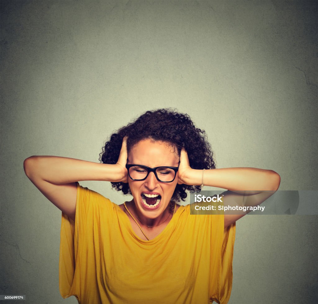 Stressed young woman screaming Mother Stock Photo