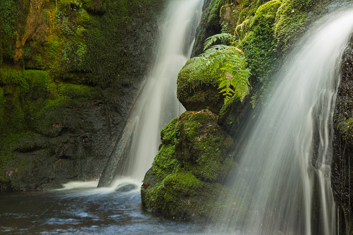 An image of cascading water at Venford Brook twin falls, using a slow shutter speed to create milky water.
