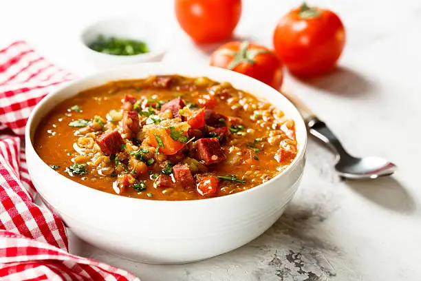 Lentil soup with tomatoes and sausages